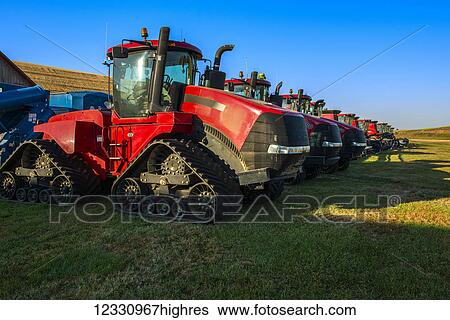 Stock Photograph - Harvesting Equipment Lined Up Ready To Begin The Harvest Day In The Palouse Region Of Eastern Washington; Washington, United States Of America. Fotosearch