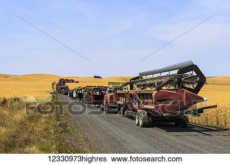 Stock Photograph - Harvesting Equipment On A Gravel Road; Washington, United States Of America. Fotosearch