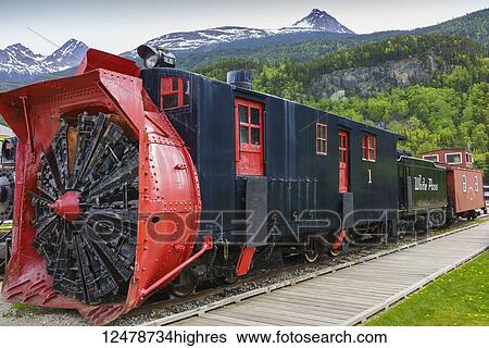 Stock Photograph - Historic White Pass Railroad with a rotary snowblower attached on display in Skagway, Southeast Alaska; Skagway, Alaska, United States of America. Fotosearch