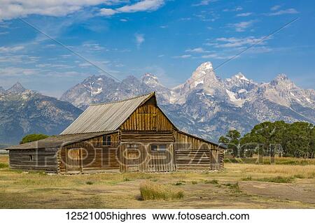 Stock Photograph - Historical Mormon barn in front of the Teton Mountain Range, Grand Teton National Park; Wyoming, United States of America. Fotosearch