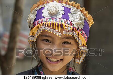 Stock Photograph - Hmong girl in tribal dress, Na Aouan Village; Luang Prabang, Laos. Fotosearch