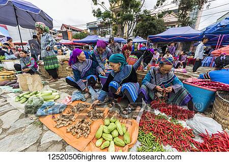 Stock Photograph - Hmong women at the Sunday market; Bac Ha, Lao Cai, Vietnam. Fotosearch