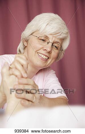 Holding the hand of the elderly View Large Photo Image Picture - Holding the hand of the elderly. Fotosearch