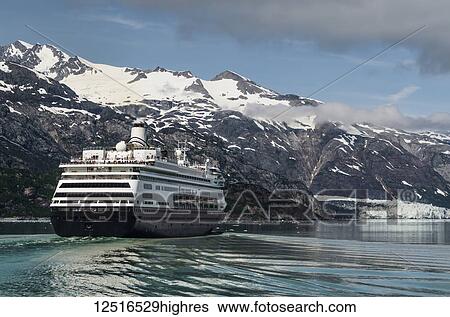 Stock Photograph - Holland America cruise ship in front of Margerie Glacier, Tarr Inlet, Glacier Bay National Park and Preserve, Southeast Alaska; Alaska, United States of America. Fotosearch