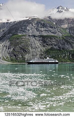 Stock Photograph - Holland America cruise ship in front of Margerie Glacier, Tarr Inlet, Glacier Bay National Park and Preserve, Southeast Alaska; Alaska, United States of America. Fotosearch