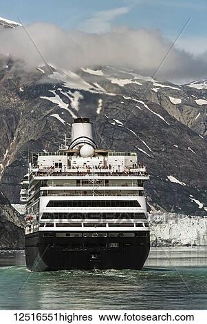 Stock Photograph - Holland America cruise ship in front of Margerie Glacier, Tarr Inlet, Glacier Bay National Park and Preserve, Southeast Alaska; Alaska, United States of America. Fotosearch