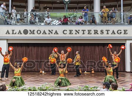 Stock Photograph - Hula dancers entertaining shoppers at the Ala Mona Shopping Center's stage in Waikiki; Honolulu, Oahu, Hawaii, United States of America. Fotosearch