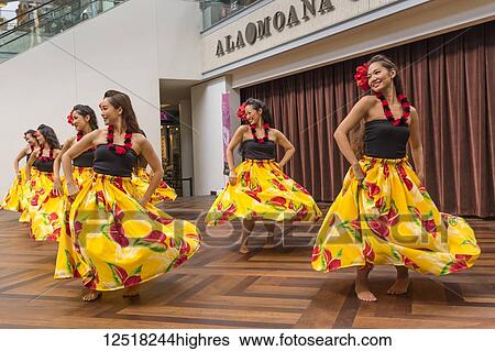 Stock Photograph - Hula dancers entertaining shoppers at the Ala Mona Shopping Center's stage in Waikiki; Honolulu, Oahu, Hawaii, United States of America. Fotosearch