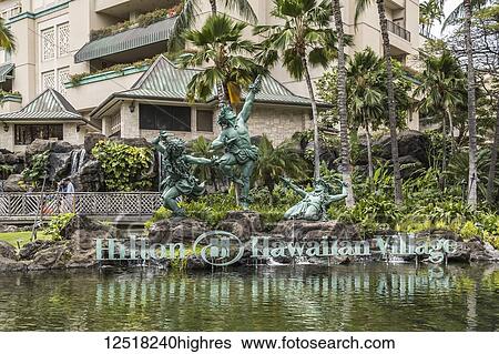 Stock Photograph - Hula Kahiko dancer statues at Hilton Hawaiian Village, Waikiki; Honolulu, Oahu, Hawaii, United States of America. Fotosearch