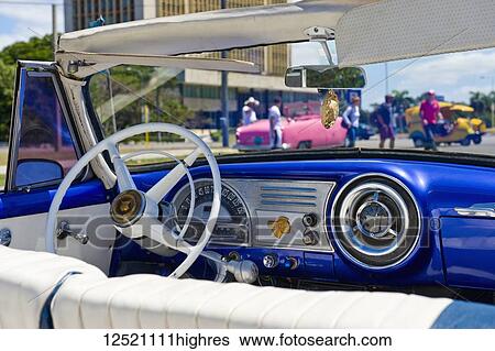 Stock Photograph - Interior of a vintage car and view through the windshield; Havana, Cuba. Fotosearch
