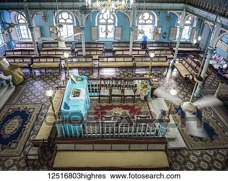 Stock Photograph - Interior of the Knesset Eliyahoo Synagogue, the city's second oldest Sephardic synagogue established in 1884; Mumbai, Maharashtra, India. Fotosearch