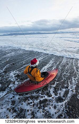 Kayak surfer preparing to enter Kachemak Bay, South-central Alaska; Homer, Alaska, United States of America View Large Photo Image Stock Photograph - Kayak surfer preparing to enter Kachemak Bay, South-central Alaska; Homer, Alaska, United States of America. Fotosearch