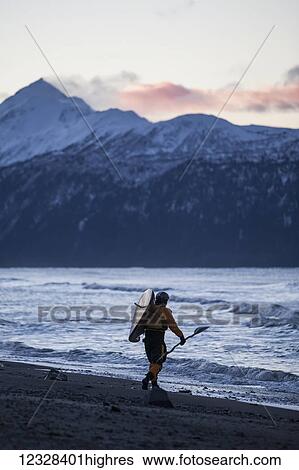 Kayaker Carries Kayak Into Kachemak Bay, Homer Spit, Southcentral Alaska, USA View Large Photo Image Stock Photograph - Kayaker Carries Kayak Into Kachemak Bay, Homer Spit, Southcentral Alaska, USA. Fotosearch