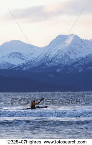 Stock Photograph - Kayaker Entering Kachemak Bay Near Homer, Southcentral Alaska, USA. Fotosearch