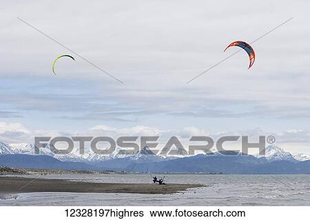 Stock Photograph - Kite Surfers Along The Homer Spit, Kachemak Bay, Kenai Peninsula, Southcentral Alaska, USA. Fotosearch