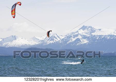 Stock Photograph - Kite Surfers In Kachemak Bay, Homer, Southcentral Alaska, USA. Fotosearch