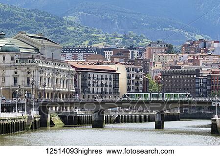 La Tranvia, local Tram crossing the Arenal bridge, with Bilbaos old town in the background; Bilbao, Vizcaya, Pais Vasco, Spain View Large Photo Image Stock Photograph - La Tranvia, local Tram crossing the Arenal bridge, with Bilbaos old town in the background; Bilbao, Vizcaya, Pais Vasco, Spain. Fotosearch