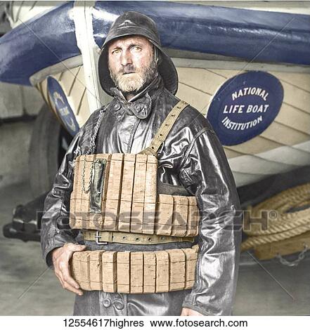 Stock Photograph - Lifeboat Coxswain with cork lifebelt from magic lantern slide circa 1900. Hand-coloured portrait of National Lifeboat Institution boat and coxswain.. Fotosearch