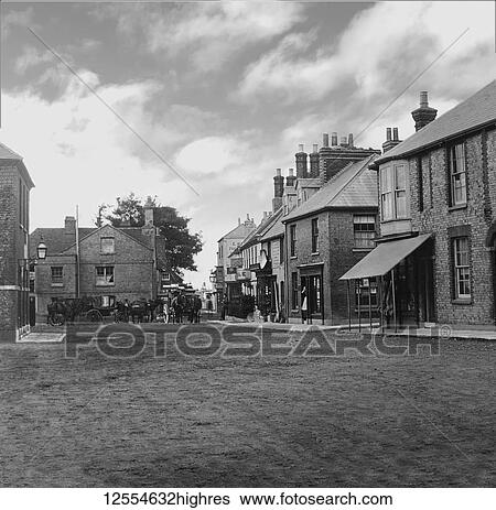 Stock Photograph - Magic lantern slide circa 1880, Victorian/Edwardian Social History. Market Square and Coaching Inn with horses and coaches outside; Yarmouth, Isle of Wight, England. Fotosearch