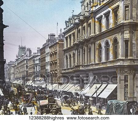 Stock Photograph - Magic Lantern slide circa 1900 hand coloured views of London, England in Victorian times. Cheapside busy street with horse drawn bus, coaches, shops and people. Fotosearch