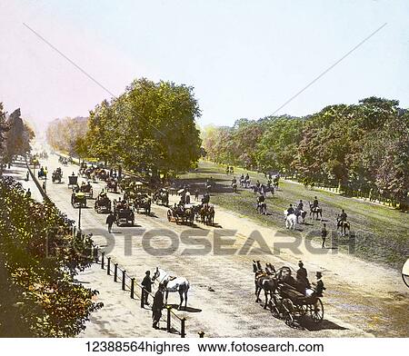 Stock Photograph - Magic Lantern slide circa 1900 hand coloured views of London, England in Victorian times. Rotten Row Hyde Park. Horses, carraiges and people walking in the park. Fotosearch