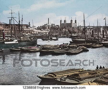 Stock Photograph - Magic Lantern slide circa 1900 hand coloured views of London, England in Victorian times. Looking across the thames towards the Toer of London. Barges, Steam Ships and other boats on the Thames. Fotosearch