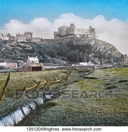 Magic Lantern slide circa 1900 hand coloured. created in 1887. A tour of North Wales. 39. Harlech Castle, from the Meadows. This fine Castle is the remains of a once important fortress, situated on an elevated rock about half-a-mile from the sea. We are... View Large Photo Image Stock Photograph - Magic Lantern slide circa 1900 hand coloured. created in 1887. A tour of North Wales. 39. Harlech Castle, from the Meadows. This fine Castle is the remains of a once important fortress, situated on an elevated rock about half-a-mile from the sea. We are.... Fotosearch