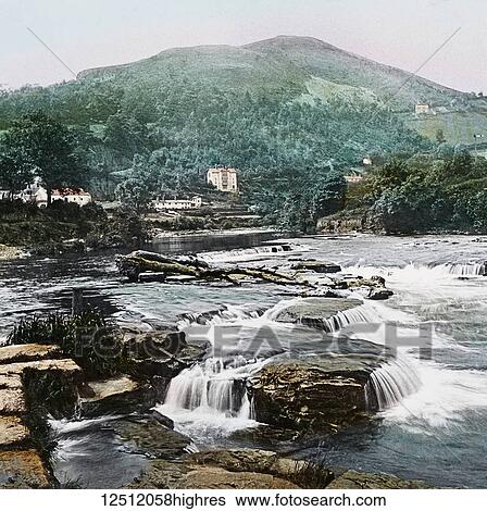 Magic Lantern slide circa 1900 hand coloured. created in 1887. A tour of North Wales. Llangollenthe River and Barbers Hill. This scene, whilst displaying the river to more advantage, is a fair specimen of the beauty of Llangollens neighbourhood. For... View Large Photo Image Stock Photograph - Magic Lantern slide circa 1900 hand coloured. created in 1887. A tour of North Wales. Llangollenthe River and Barbers Hill. This scene, whilst displaying the river to more advantage, is a fair specimen of the beauty of Llangollens neighbourhood. For.... Fotosearch