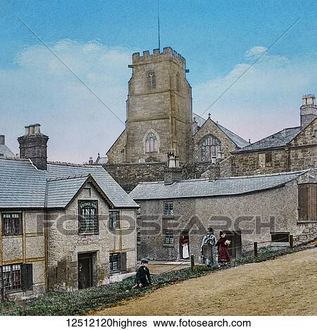 Stock Photograph - Magic Lantern slide circa 1900 hand coloured. The Bridge End Inn in Ruabon (Welsh: Rhiwabon pronounced [r??????b? n]) A village and community in the county borough of Wrexham in Wales. The name Rhiwabon comes from Rhiw Fabon, Rhiw being the Welsh word.... Fotosearch