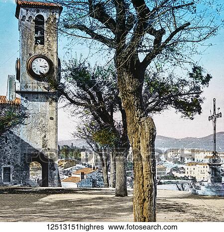 Stock Photograph - Magic Lantern slide circa 1900 hand coloured. Titled Cities and places of interest in the Mediterranean. 13. THE CATHEDRAL TOWER ON MONT CHEVALIER. This cathedral, or as it. is commonly called the Church of Notre Dame dEsperance, is situated close by.... Fotosearch