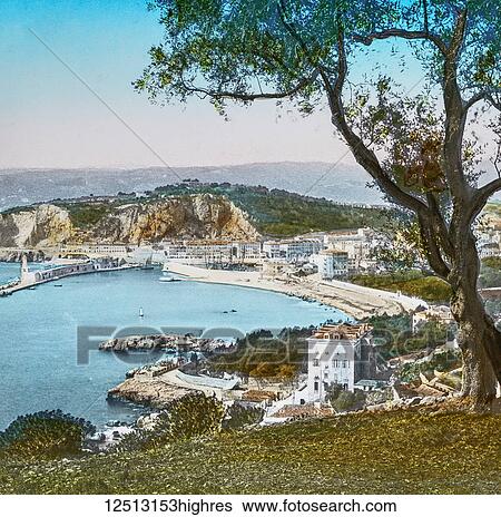 Stock Photograph - Magic Lantern slide circa 1900 hand coloured. Titled Cities and places of interest in the Mediterranean. 15. NICE FROM THE VILLEFRANCHE ROAD. We are at Nice, and one of the most usual excursions made from there is to Villefranche, whence an excellent.... Fotosearch