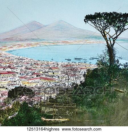 Stock Photograph - Magic Lantern slide circa 1900 hand coloured. Titled Cities and places of interest in the Mediterranean. No. 30. NAPLES FROM THE ST. ELMO ROAD. We pass still farther south, and we arrive at Naples, than which there is no city more beatifully situated..... Fotosearch