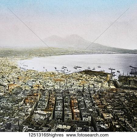 Stock Photograph - Magic Lantern slide circa 1900 hand coloured. Titled Cities and places of interest in the Mediterranean. 31. THE BAY OP NAPLES AND VESUVIUS. The volcanic mountain of Vesuvius is the great attraction of the traveller who does not go to Naples for.... Fotosearch