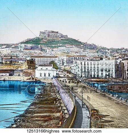 Stock Photograph - Magic Lantern slide circa 1900 hand coloured. Titled Cities and places of interest in the Mediterranean. No. 32. THE CASTLE OF. ST. ELMO, NAPLES, AND THE MARINA. This fortress, which from its situation and from the enormous thickness of its walls, is.... Fotosearch