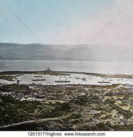 Stock Photograph - Magic Lantern slide circa 1900 hand coloured. Titled Cities and places of interest in the Mediterranean. 37. MESSINA FROM THE HILLS. Proceeding still farther south in our Mediterranean tour, we arrive in the Island of Sicily, and at its second most.... Fotosearch