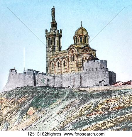 Stock Photograph - Magic Lantern slide circa 1900 hand coloured. Titled Cities and places of interest in the Mediterranean. 5THE CHURCH OF NOTRE DAME DE LA GARDE. It is not only the beauty of this church, but its pathetic associations also that appeal to the minds of.... Fotosearch