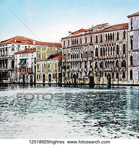 Stock Photograph - Magic Lantern slide circa 1900 hand coloured. Victorian/Edwardian era. The Foscari Palaces onthe Grand Canal Venice, Italy in 1889. Fotosearch