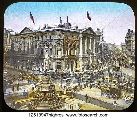 Stock Photograph - Magic Lantern slide circa 1900 hand coloured views of London, England in Victorian times. Piccadily Circus, very busy with trms, coaches, people.. Fotosearch