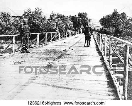 Stock Photograph - Magic lantern slide circa 1900. Victorian, Two soldiers guard bridge during WW1. Sentry box on bridge. Fotosearch