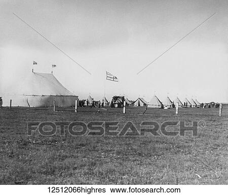 Stock Photograph - Magic lantern slide circa 1900. Victorian. Social History. Orphan Asylum camp with tents and flags. Fotosearch