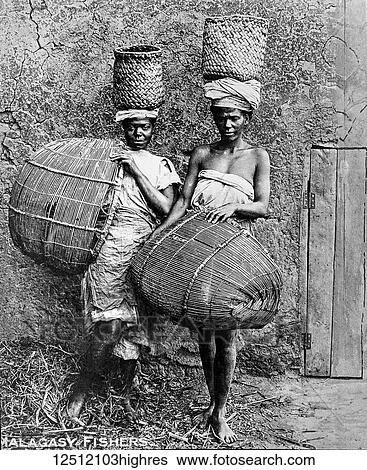 Stock Photograph - Magic lantern slide circa 1900. Victorian. Social History. Society for the propagation of the gospel in foreign parts. Missionary work in Madagascar off the coast of Africa. Malagasy fishers, women fishing with baskets. Fotosearch