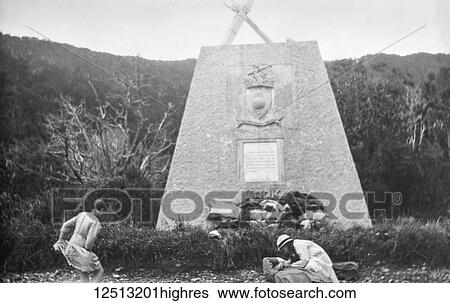 Stock Photograph - Magic lantern slide circa 1900. Victorian/Edwardian social history. James Cook monument at Ships Cove, SOuth Island New Zealand. A plaque on the monument reads: 'To this Cove Captain Cook made five visits while navigating the globe. On this beach he.... Fotosearch