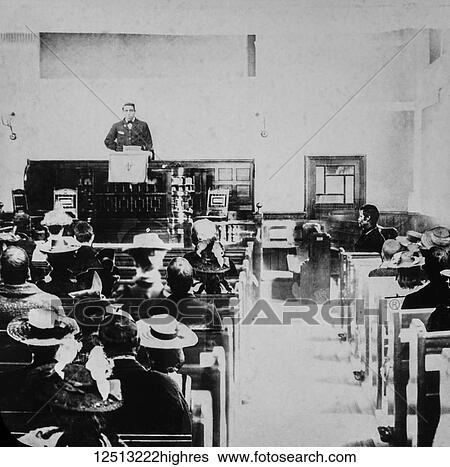 Magic lantern slide circa 1900. Victorian. Social History. Image from a slide presentation entitled In His step or In jesus Name. The minister ( reverend ) preaching to his congregation. This picture shows the crude montage effect achieved in early... View Large Photo Image Stock Photograph - Magic lantern slide circa 1900. Victorian. Social History. Image from a slide presentation entitled In His step or In jesus Name. The minister ( reverend ) preaching to his congregation. This picture shows the crude montage effect achieved in early.... Fotosearch