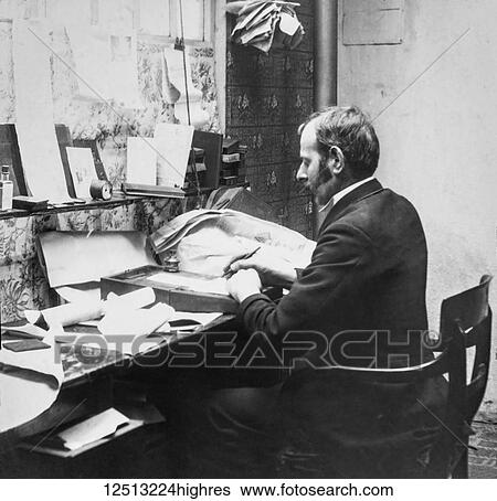 Stock Photograph - Magic lantern slide circa 1900. Victorian. Social History. Image from a slide presentation entitled In His step or In jesus Name. Managing director writing in his office. printing company with boss sitting at desk. Fotosearch