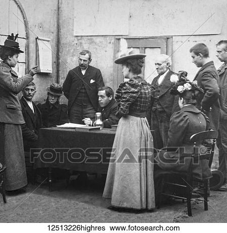 Stock Photograph - Magic lantern slide circa 1900. Victorian. Social History. Image from a slide presentation entitled In His step or In jesus Name. Congregation meeting in vestry of church with minister. Fotosearch