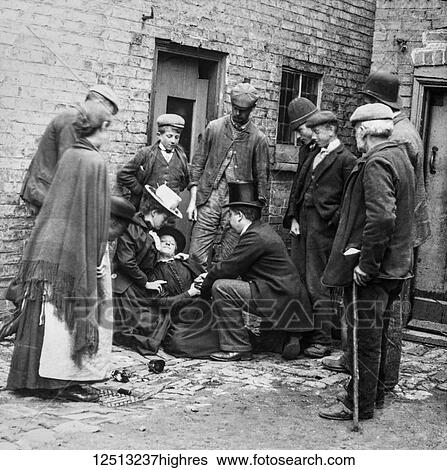 Stock Photograph - Magic lantern slide circa 1900. Victorian. Social history images from In his steps Or What would Jesus do? The readings from the popular story of C. M. Sheldon Compiled by Thomas Mitchell. Someone had thrown a heavy bottle. It struck Loreon on the head,.... Fotosearch