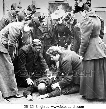 Magic lantern slide circa 1900. Victorian. Social History. Image from a slide presentation entitled In His step or In jesus Name. beggar, poor man collapsed on the ground a group of people trying to help him View Large Photo Image Stock Photograph - Magic lantern slide circa 1900. Victorian. Social History. Image from a slide presentation entitled In His step or In jesus Name. beggar, poor man collapsed on the ground a group of people trying to help him. Fotosearch