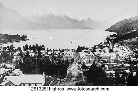 Stock Photograph - Magic lantern slide circa 1900. Victorian/Edwardian social history. Queenstown New Zeland view during winter. Snow and ice on the ground. Fotosearch