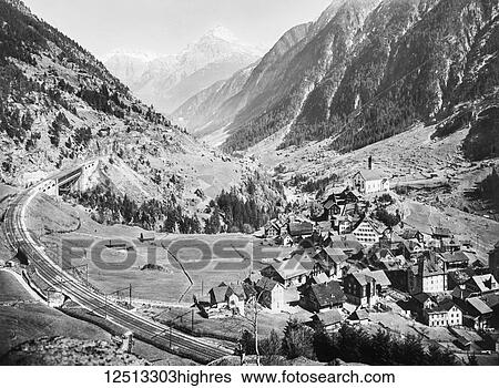 Stock Photograph - Magic lantern slide circa 1900. Victorian, Landscape view of Wassen and Windgalle including unique railway lin. The villlage is in Switzerland surounded by mountains. Fotosearch