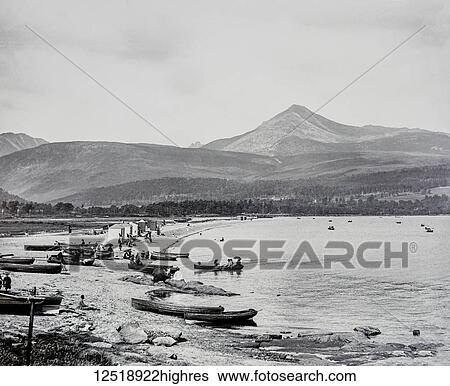 Stock Photograph - Magic lantern slide circa 1900. Victorian/Edwardian. Social History. Brodick (Scottish Gaelic: Trigh a' Chaisteil (Castle Beach) or Breadhaig) is the main town on the Isle of Arran, in the Firth of Clyde, Scotland. It is halfway along the east coast of.... Fotosearch